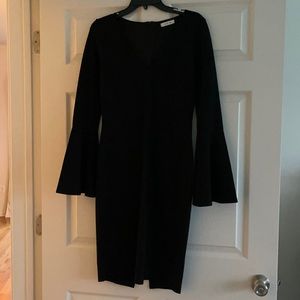 Tight black long sleeve dress